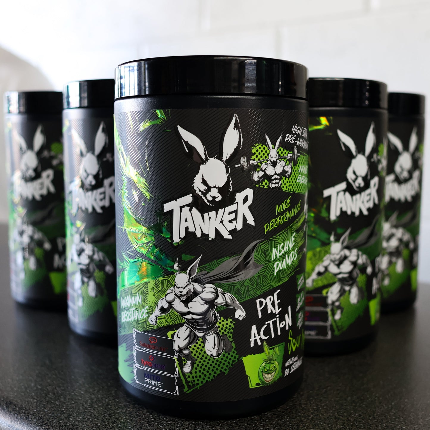 Tanker pre-action supplement containers on a black surface with a white background
