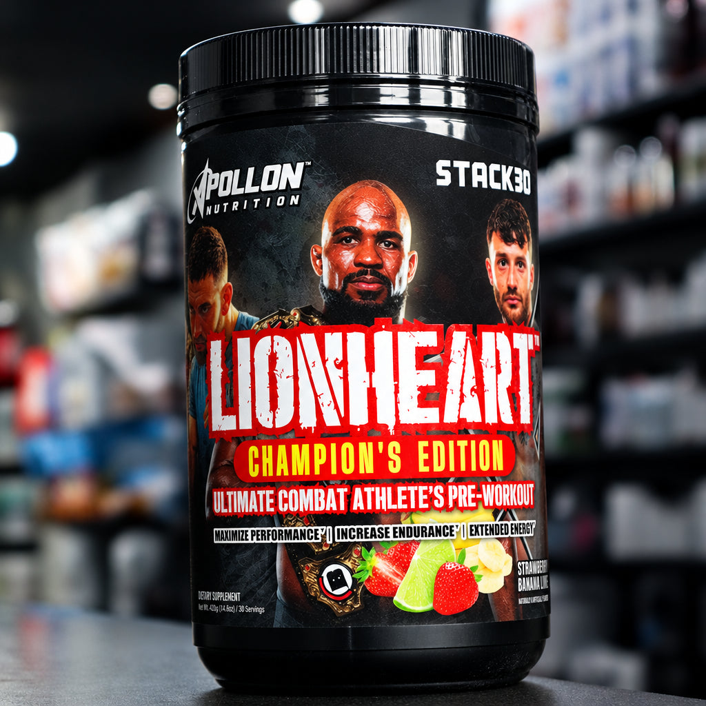 A tub of Apollon Nutrition Stacked Lionheart Champion's Edition protein powder sits on a countertop in a store setting with blurred shelves in the background.