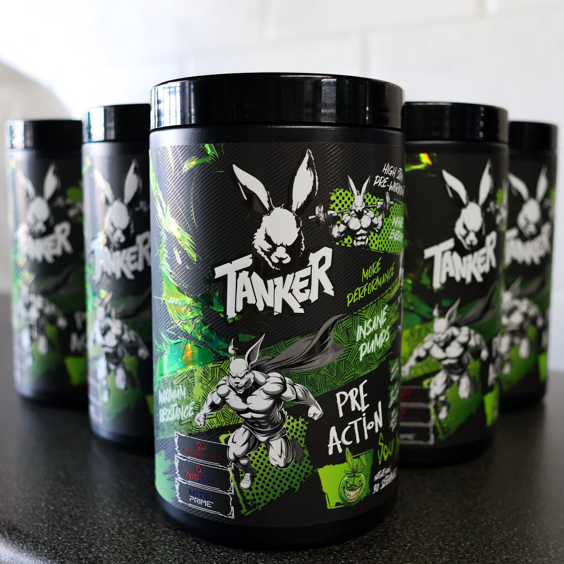 Tanker pre-action supplement containers on a black surface with a white background