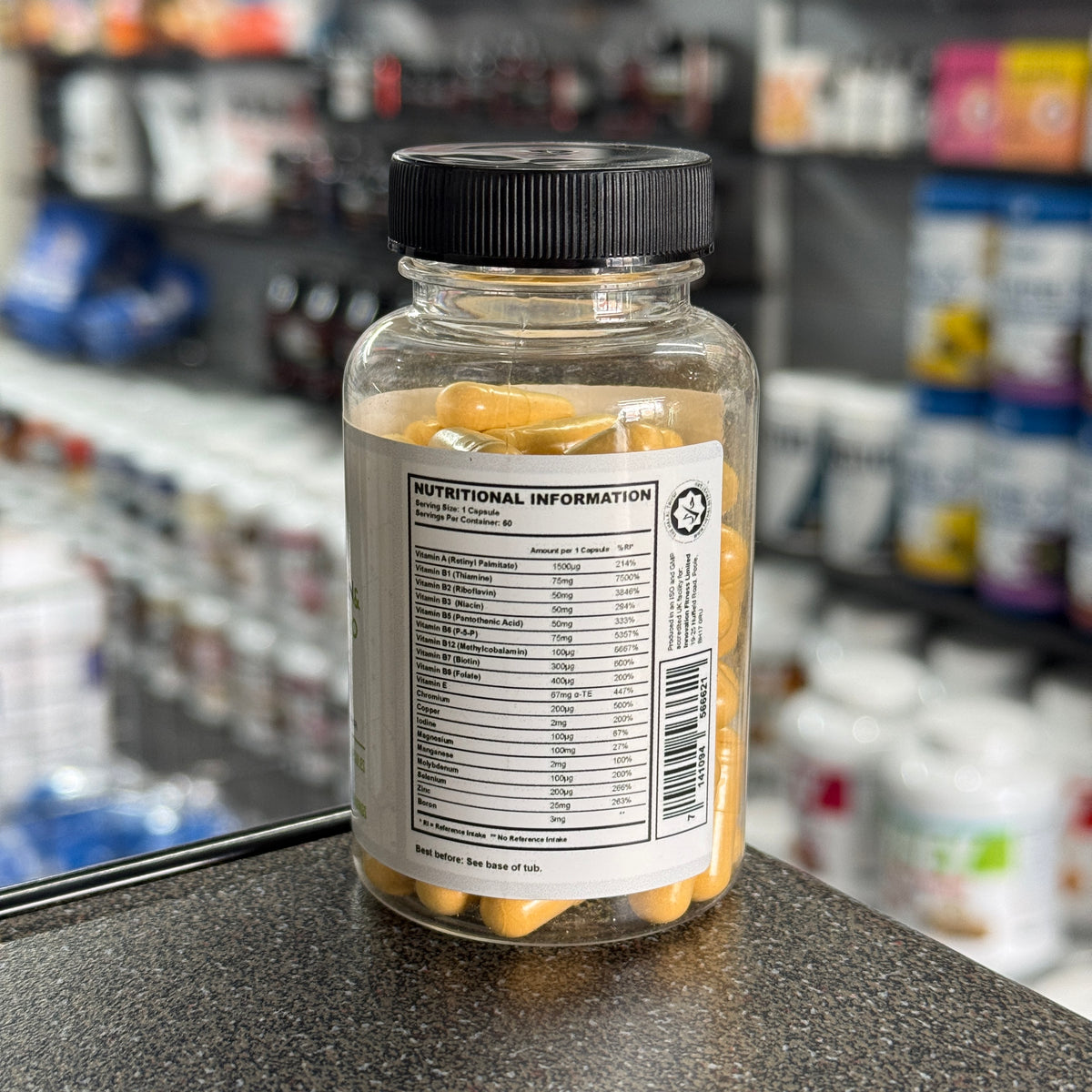Nutritional information label of Dr. Dean St. Marts multivitamin and mineral pro 60 capsules against a blurred supplement store background