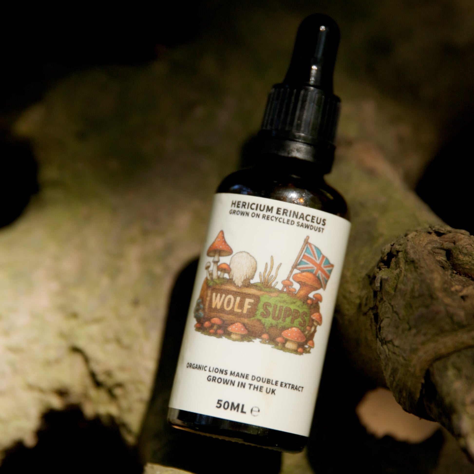 A small amber glass dropper bottle labeled Wolf Butch Beard Balm, set against a dark background with rustic stone props.