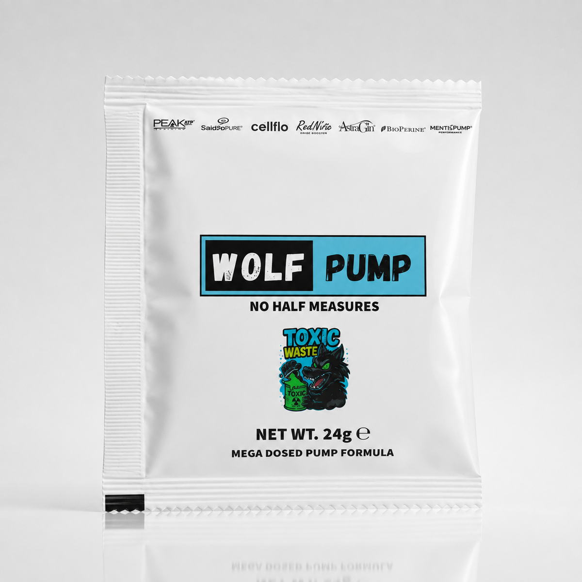 A single white foil packet of Wolf Pump Toxic Waste Mega Dosed Pump Formula, standing upright on a light gray reflective surface.